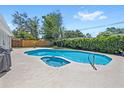 Backyard pool with spa and spacious patio area, perfect for outdoor relaxation and entertaining at 2220 Derbyshire Rd, Maitland, FL 32751