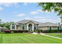 Charming single-story home boasts a well-manicured lawn and inviting curb appeal, perfect for families at 245 Meadow Bay Ct, Lake Mary, FL 32746