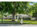 Landscaped front yard and a mailbox number plaque add a welcoming touch to this well-maintained house at 245 Meadow Bay Ct, Lake Mary, FL 32746
