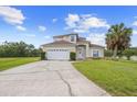 Charming two-story home with a well-manicured lawn and a spacious driveway at 412 Mallard Way, Kissimmee, FL 34759