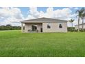 Enjoy the expansive backyard featuring a covered patio, perfect for relaxation and entertaining at 5909 Cliffbow Loop, Leesburg, FL 34748