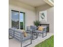 This covered patio offers comfortable seating and outdoor living space at 5909 Cliffbow Loop, Leesburg, FL 34748