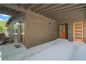 Outdoor area with covered parking, featuring two exterior doors and recessed lighting at 116 E Lauren Ct, Fern Park, FL 32730