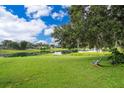 Expansive backyard with a view of the lake, perfect for relaxation and outdoor activities at 1504 E Gore St, Orlando, FL 32806