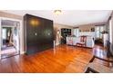 Spacious living room with hardwood floors, offering ample space for entertaining and relaxation at 1504 E Gore St, Orlando, FL 32806