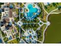 Aerial view showcasing the community pool, landscaping, and amenities surrounding the property at 1592 Carey Palm Cir, Kissimmee, FL 34747