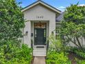 Close-up of the front door highlighting its design, sidelights, and the home's address number, '1640' at 1640 Mayfield Ave, Winter Park, FL 32789