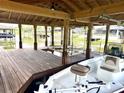 Covered boat lift with wooden floors, beams, and a new boat at 1811 Missouri Ave, Sanford, FL 32771