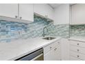 Kitchen featuring white countertops, stainless steel appliances, and designer backsplash at 2700 Ocean Shore Blvd # 515, Ormond Beach, FL 32176