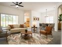 Bright living room featuring contemporary furnishings, neutral walls and large windows offering backyard views at 340 Sorrento Rd, Kissimmee, FL 34759