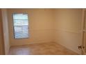 Neutral bedroom with tile floors and white walls at 1524 Crawford Dr, Apopka, FL 32703