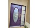 Close up of a modern front door with a large glass window and sidelight at 1524 Crawford Dr, Apopka, FL 32703