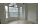 Bright, open living room with tile flooring and large windows at 1524 Crawford Dr, Apopka, FL 32703