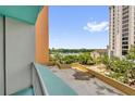 Balcony view overlooking a lake, greenery, and other buildings on a sunny day at 322 E Central Blvd # 614, Orlando, FL 32801