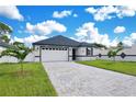 Attractive single-Gathering home boasts a manicured lawn and a neutral gray exterior at 3507 W Jefferson St, Orlando, FL 32805