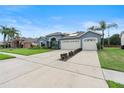 Charming one-story home featuring a well-manicured lawn and a spacious two-car garage at 4110 Maplegrove Dr, Orlando, FL 32818