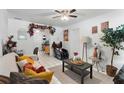 Inviting living room featuring tile floors, neutral walls, comfortable seating, and bright, natural light at 4654 Alhama St, Orlando, FL 32811