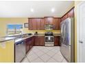 Modern kitchen featuring stainless steel appliances, granite countertops, and ample cabinetry at 540 Vitoria Rd, Davenport, FL 33837
