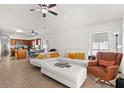 Bright living room featuring tile flooring, a ceiling fan, and a white sectional sofa at 8852 Fort Jefferson Blvd, Orlando, FL 32822