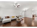 Spacious living room with gleaming hardwood floors, neutral paint, and ample natural light at 8852 Fort Jefferson Blvd, Orlando, FL 32822