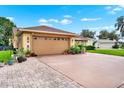 This beautiful home includes a two-car garage and brick paver driveway, adding character and value at 1709 Kinsman Way, Lakeland, FL 33809
