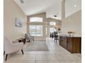 Bright and airy living room with vaulted ceilings and neutral tones at 211 Tavestock Loop, Winter Springs, FL 32708