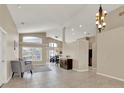 Spacious living room featuring high ceilings, tile floors, and large windows at 211 Tavestock Loop, Winter Springs, FL 32708