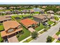 Beautiful aerial view showing neighborhood with a playground and pond nearby at 212 Lugano Way, Debary, FL 32713