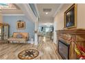 Ornate formal living area with tiled floors, fireplace, and decoratively painted ceiling at 617 Marsh Reed Dr, Winter Garden, FL 34787
