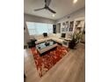 Spacious living room features hardwood floors and a stylish sectional sofa at 740 Naples Dr, Orlando, FL 32804