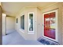 Inviting front porch with a red door and a well-lit entryway at 910 Amy Ridge Ct, Kissimmee, FL 34747