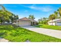 Well-kept ranch-style home boasting a spacious front yard and paved driveway at 910 Amy Ridge Ct, Kissimmee, FL 34747