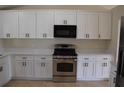 Bright kitchen features white cabinets, modern appliances and neutral countertops at 910 Amy Ridge Ct, Kissimmee, FL 34747