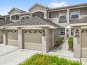 Attractive townhome with attached garages and well-maintained landscaping at 9440 Myrtle Creek Ln # 1003, Orlando, FL 32832