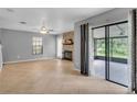 Spacious living room featuring tile floors, neutral paint, and a fireplace at 995 Troon Trce, Winter Springs, FL 32708