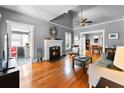 Bright living room with a charming fireplace, hardwood floors, and an open layout at 110 N Brown Ave, Orlando, FL 32801