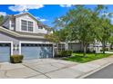 Attractive two-story home featuring an attached two-car garage and a well-maintained front yard at 1461 Travertine Ter, Sanford, FL 32771