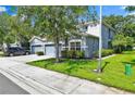 Inviting two-story home with a well-kept lawn and beautiful landscaping, offering great curb appeal at 1461 Travertine Ter, Sanford, FL 32771