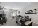 Cozy living room and dining area featuring neutral colors, comfortable seating, and natural light at 2605 Gala S Rd # 106, Kissimmee, FL 34746