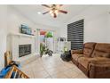 Cozy living room featuring a brick fireplace and sliding glass door leading to the outdoors at 298 San Gabriel St, Winter Springs, FL 32708