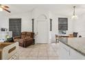 Bright living room with tile floors, and neutral paint, illuminated by natural light through the windows at 298 San Gabriel St, Winter Springs, FL 32708