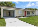 A well-maintained single-Gathering home with a neat lawn and a convenient carport at 4825 Loretta Ln, Orlando, FL 32821