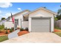 Lovely single-Gathering home with a one car garage and walkway to front door at 745 Ashley Ln, Orlando, FL 32825