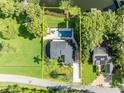 An aerial view of the property showing its location, layout, pool and waterfront access at 7801 Georgeann St, Winter Park, FL 32792