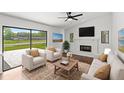 Bright living room with modern furniture, fireplace, and expansive sliding glass doors at 400 Timbercreek N Dr, Winter Garden, FL 34787