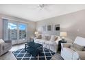 Comfortable living room featuring a walk out balcony and neutral tones at 4151 S Atlantic Ave # 5110, New Smyrna Beach, FL 32169