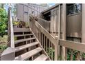 Charming home exterior featuring a private entry with stairs and a wood facade at 5310 Pebble Beach Dr # F, Orlando, FL 32811