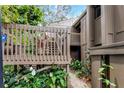 Inviting home exterior featuring a private entry deck with potted plants and lush landscaping at 5310 Pebble Beach Dr # F, Orlando, FL 32811