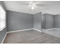 Open living space with wood-look floors, fresh paint, and abundant natural light at 606 Washington St, Daytona Beach, FL 32114