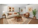 Cozy living room featuring stylish furniture, neutral tones, and natural light at 710 N Sparkman Ave, Orange City, FL 32763